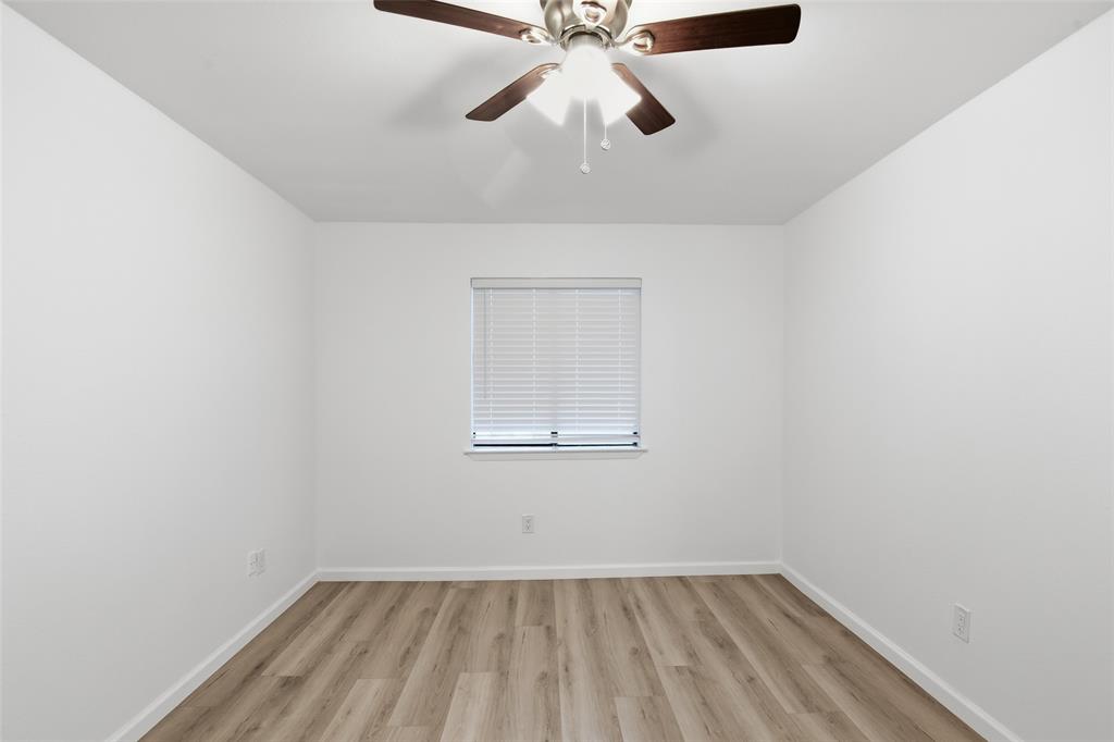 6646 East Lovers Lane, Unit 1201 Dallas, TX 75214 - Photo 14 of 24 an empty room with a window and a fan