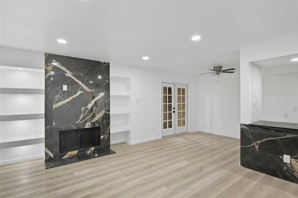 6646 East Lovers Lane, Unit 1201 Dallas, TX 75214 - Photo 3 of 24 wooden floor in an empty room with a fireplace