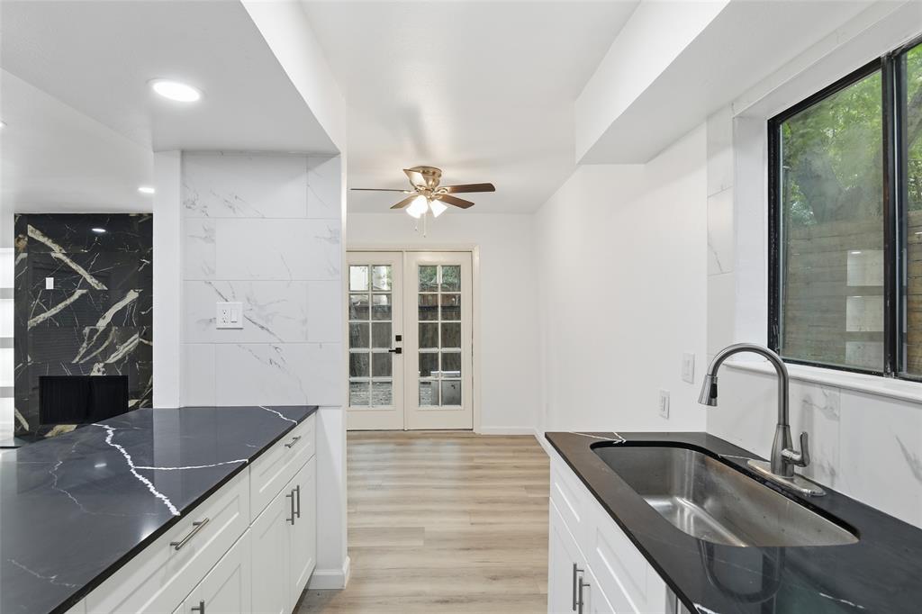 6646 East Lovers Lane, Unit 1201 Dallas, TX 75214 - Photo 7 of 24 a kitchen with granite countertop a sink stainless steel appliances and cabinets