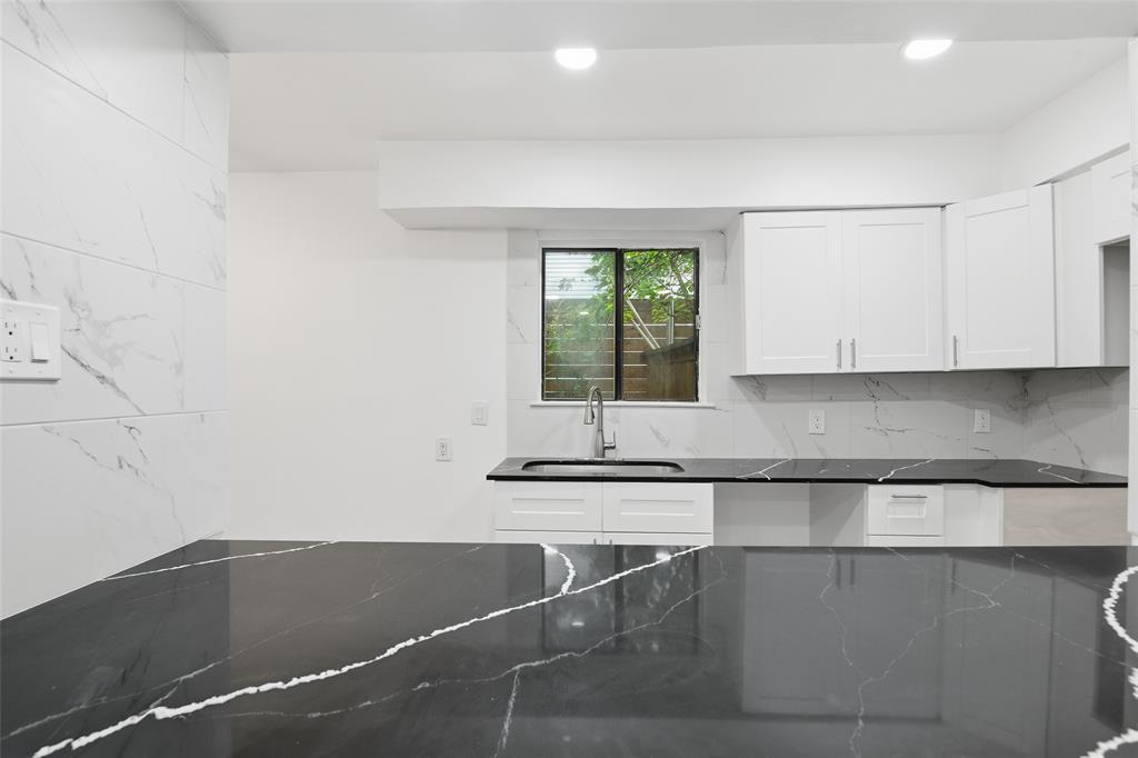 6646 East Lovers Lane, Unit 1201 Dallas, TX 75214 - Photo 8 of 24 a kitchen with a sink and cabinets