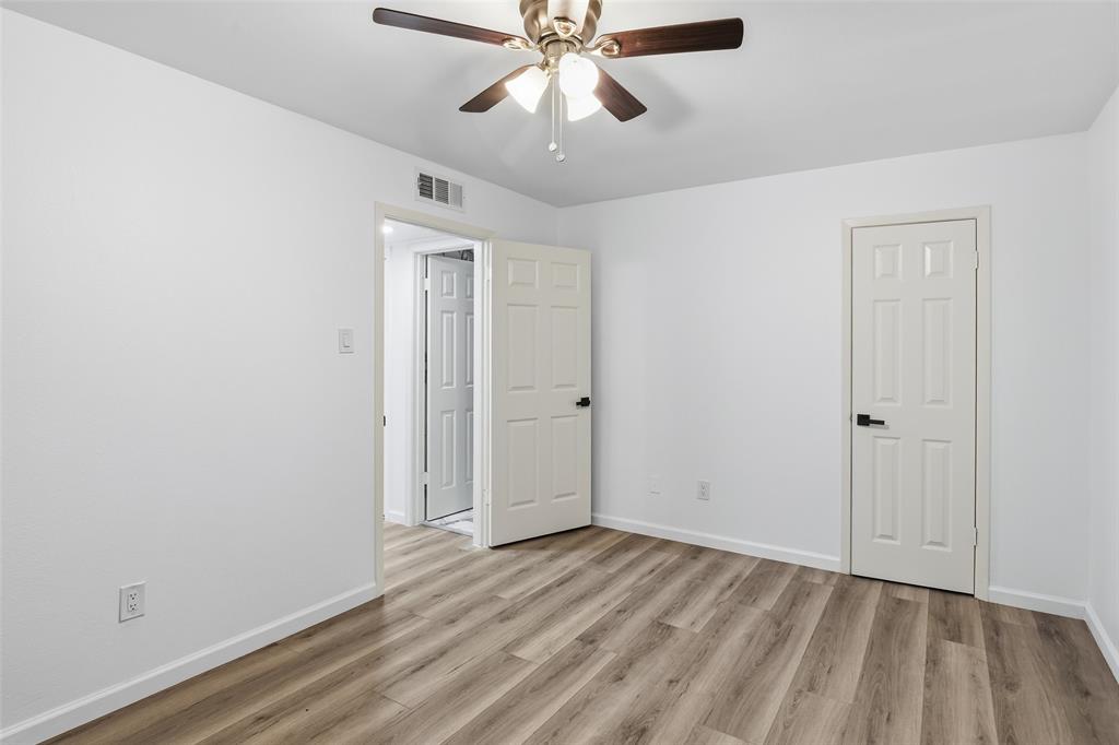 6646 East Lovers Lane, Unit 1201 Dallas, TX 75214 - Photo 10 of 24 a view of an empty room and chandelier fan