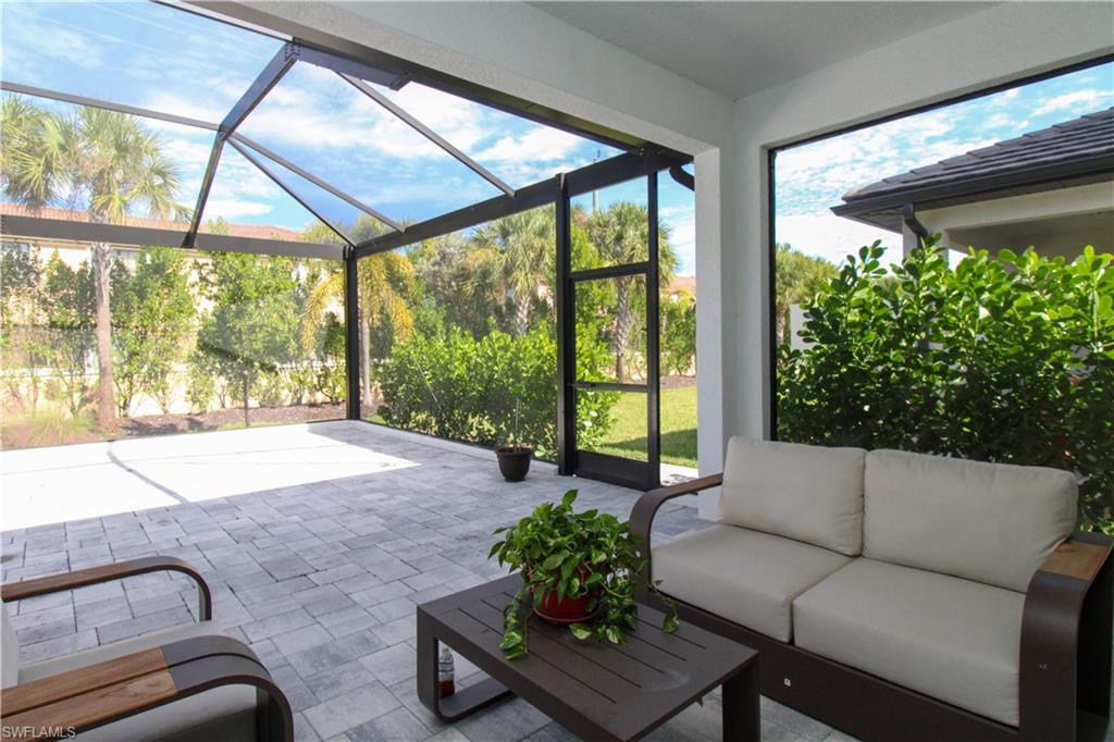 14803 Loggerhead Drive Naples, FL 34120 - Photo 13 of 50 a living room with furniture and a large window