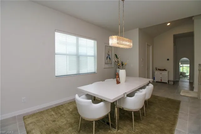 a view of a dining room with furniture and window