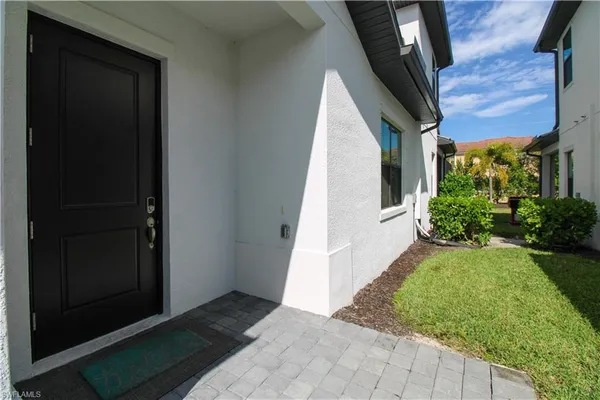 a view of a back yard from a corridor