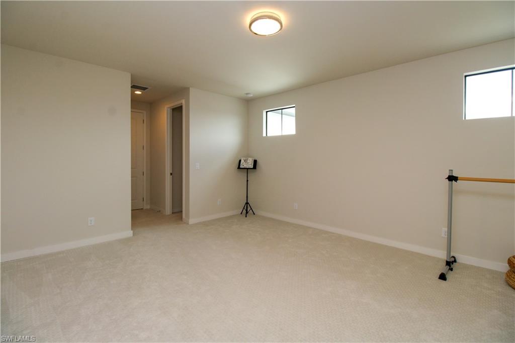 14803 Loggerhead Drive Naples, FL 34120 - Photo 45 of 50 a view of an empty room with a window