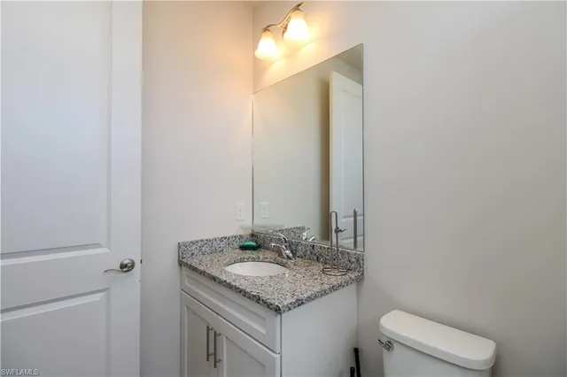 a bedroom with a bed and a cabinets