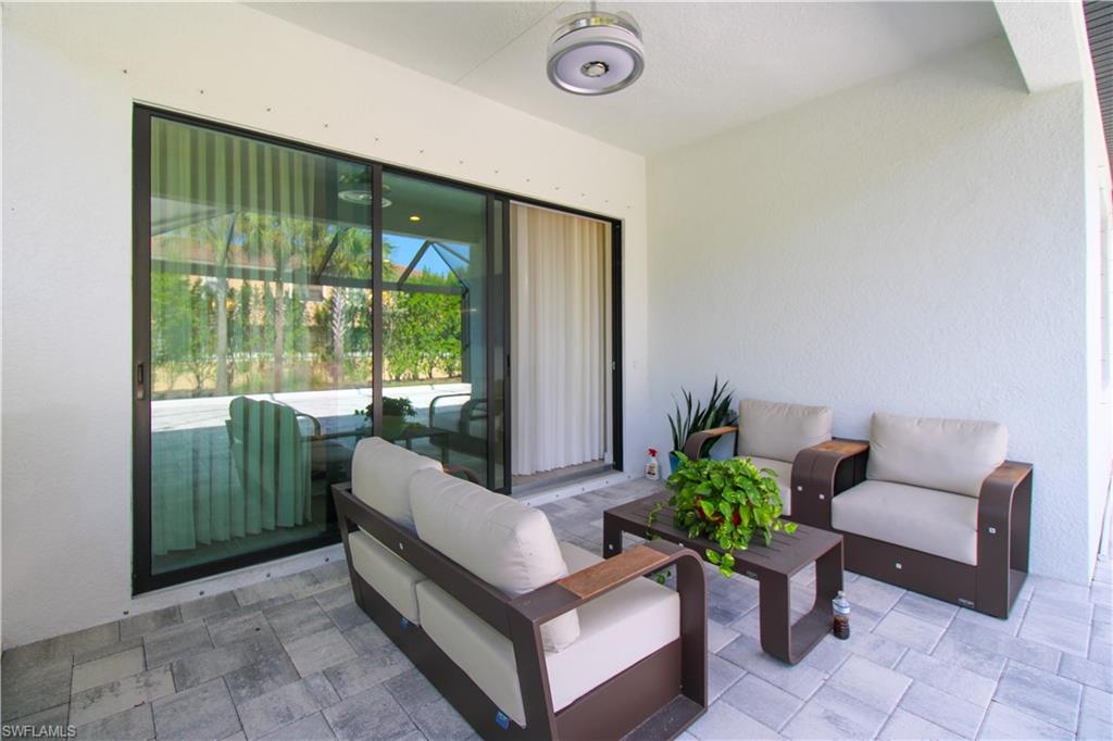 14803 Loggerhead Drive Naples, FL 34120 - Photo 6 of 50 a living room with furniture and a large window