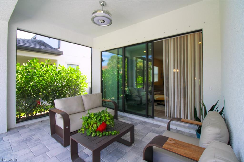 14803 Loggerhead Drive Naples, FL 34120 - Photo 7 of 50 a living room with furniture and a potted plant