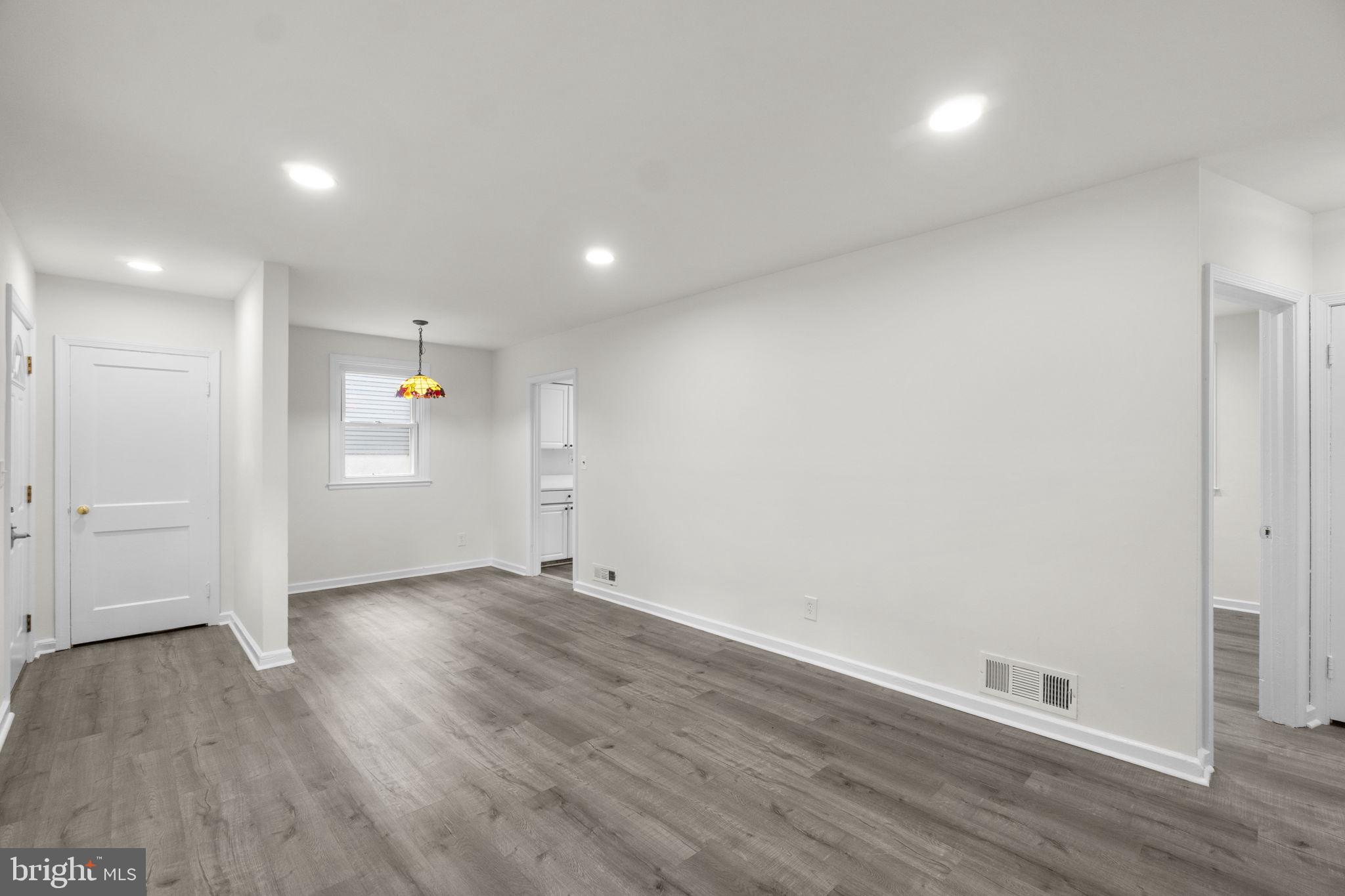 3658 Clifmar Road Baltimore, MD 21244 - Photo 13 of 43 an empty room with wooden floor & windows