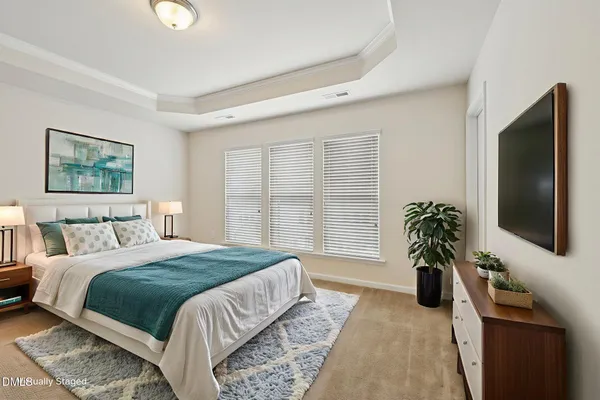 a bedroom with a large bed and a large window