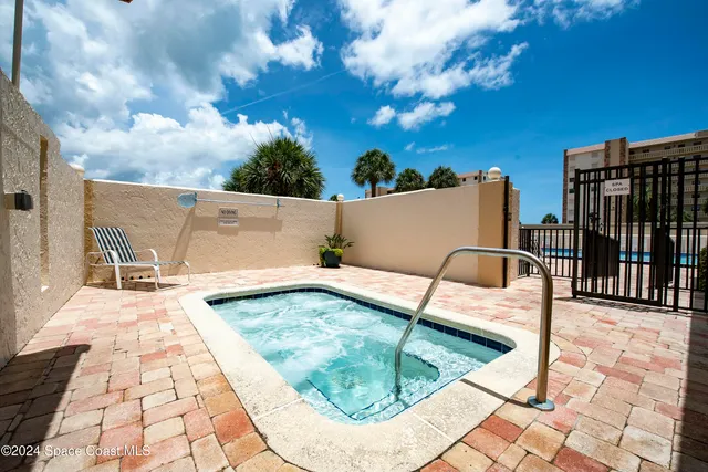 a view of a swimming pool with a lounge chairs