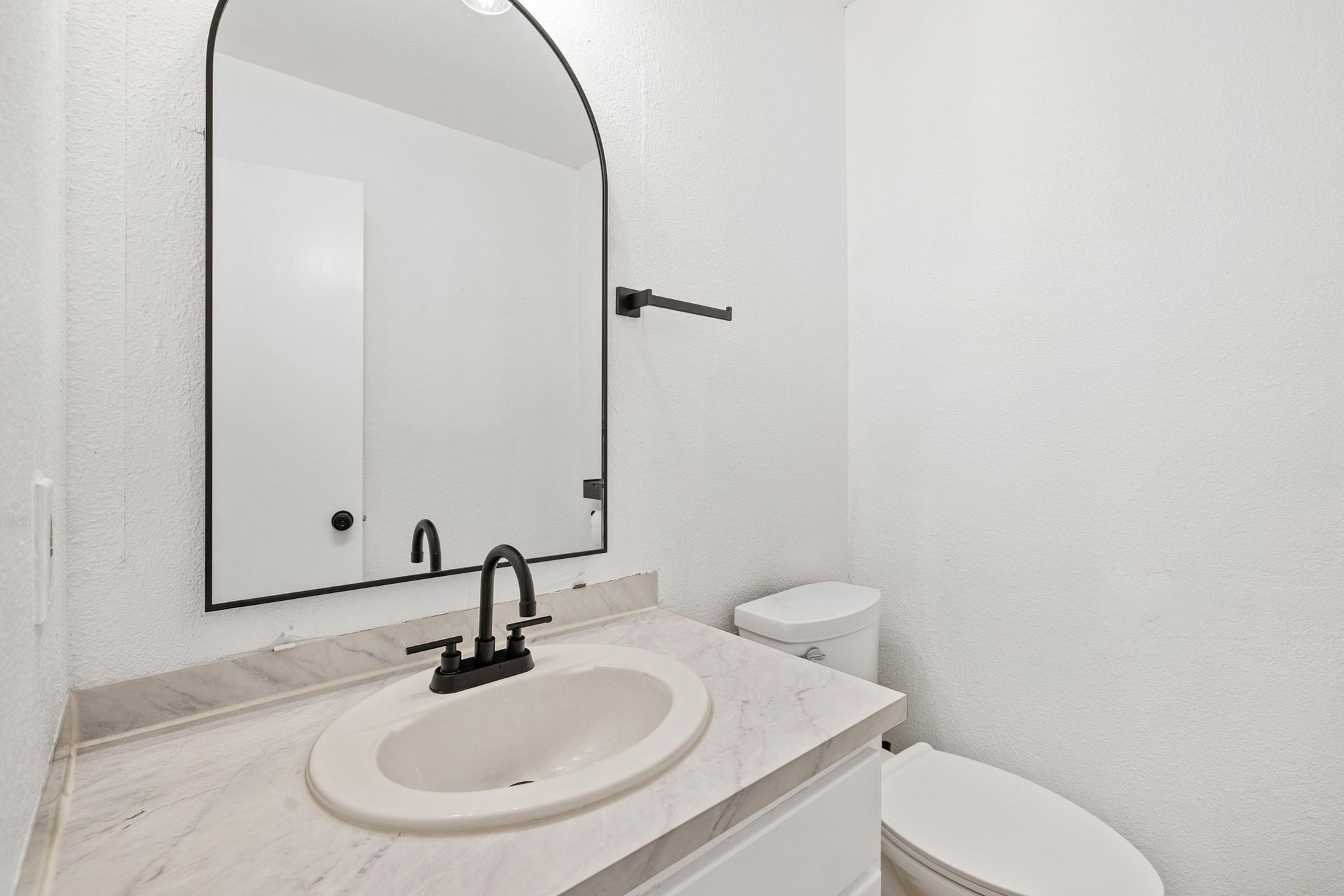 1010 West Rundberg Lane, Unit 30 Austin, TX 78758 - Photo 14 of 30 a bathroom with a sink and a mirror