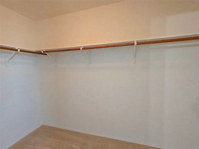 a view of a room with shelf on the wall