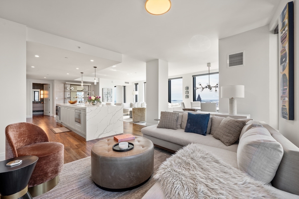 110 Sudbury Street, Unit 4002 Boston, MA 02114 - Photo 16 of 42 a living room with furniture and kitchen view