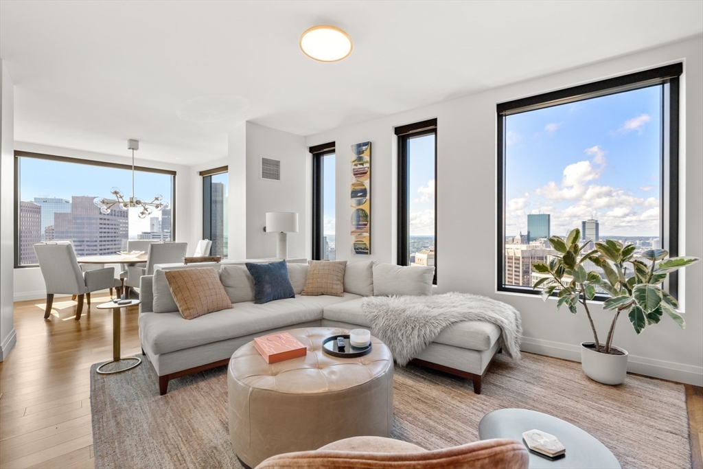 110 Sudbury Street, Unit 4002 Boston, MA 02114 - Photo 17 of 42 a living room with furniture and a large window