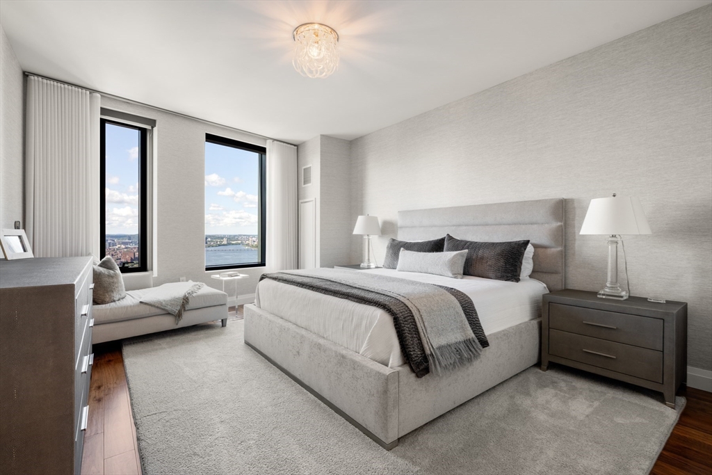 110 Sudbury Street, Unit 4002 Boston, MA 02114 - Photo 19 of 42 a spacious bedroom with a bed and large window