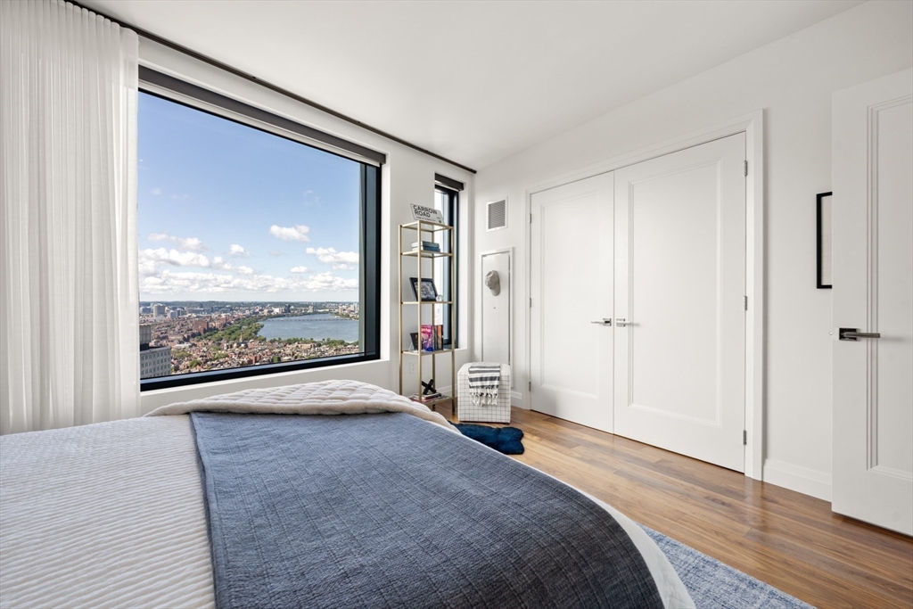 110 Sudbury Street, Unit 4002 Boston, MA 02114 - Photo 22 of 42 a view of a big room with wooden floor and windows