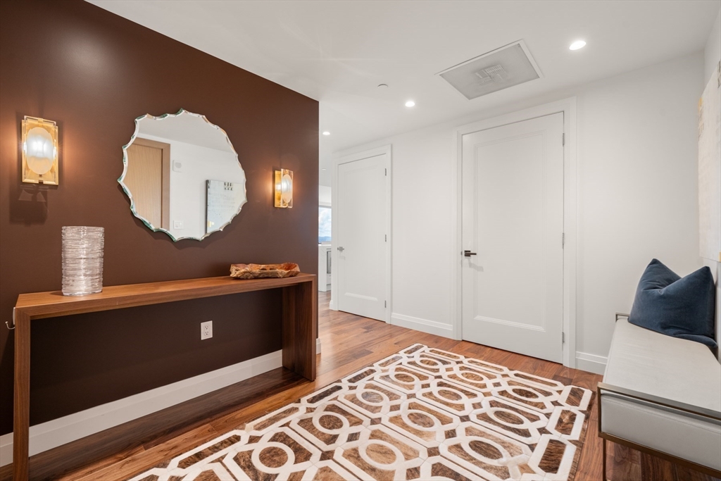 110 Sudbury Street, Unit 4002 Boston, MA 02114 - Photo 24 of 42 a view of a hallway with wooden floor windows and a wooden floor