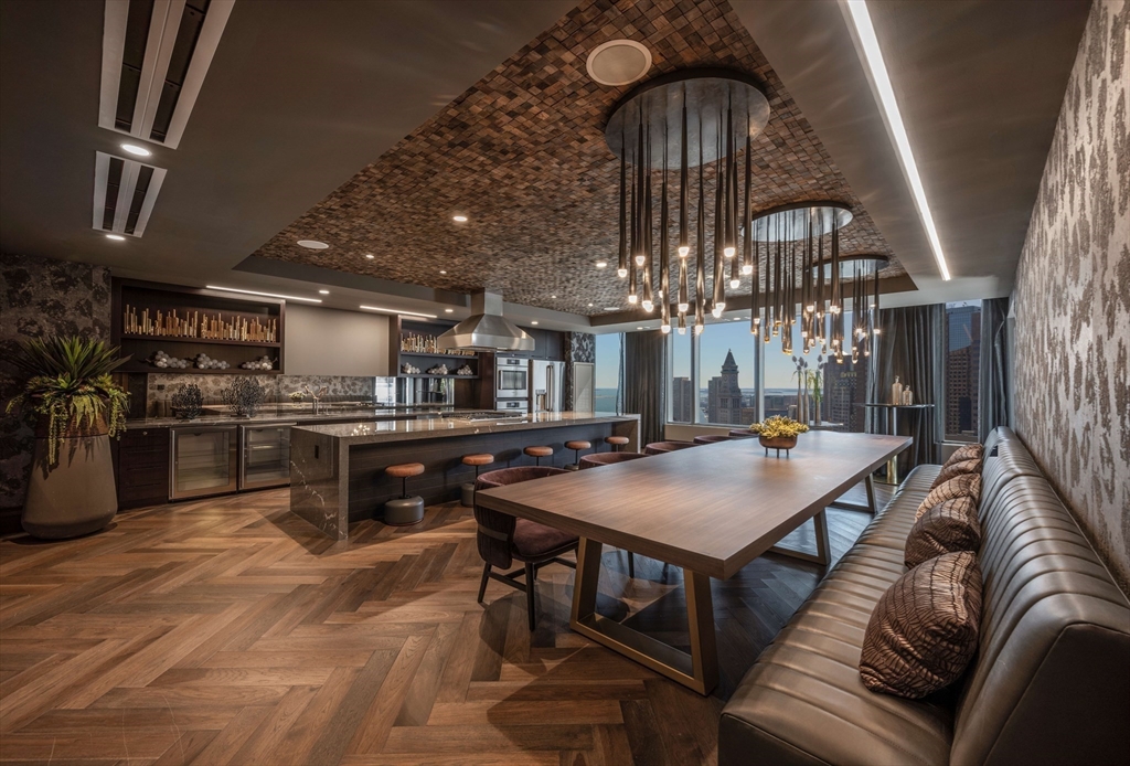 110 Sudbury Street, Unit 4002 Boston, MA 02114 - Photo 39 of 42 a living room with stainless steel appliances furniture a chandelier and kitchen view