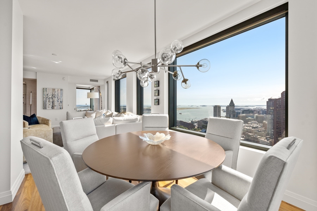 110 Sudbury Street, Unit 4002 Boston, MA 02114 - Photo 7 of 42 a dining room with furniture and a chandelier