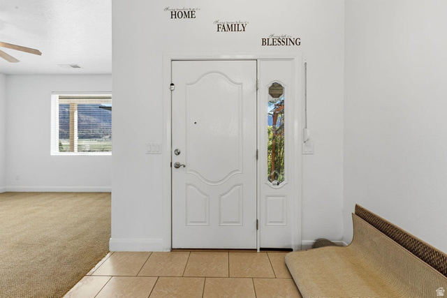 1001 Pine Valley Road Pine Valley, UT 84781 - Photo 9 of 49 Foyer entrance featuring light carpet, light tile patterned floors, and a ceiling fan