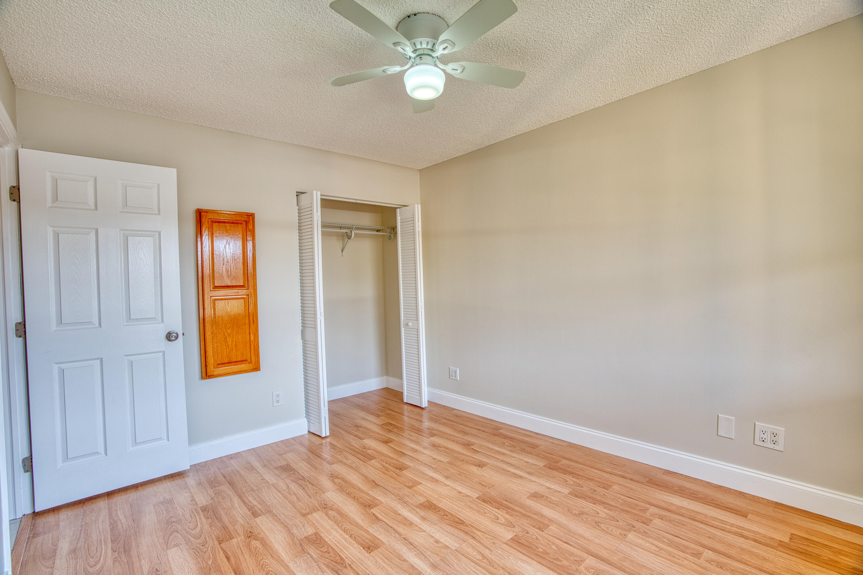 3151 Southeast Aster Lane, Unit 1306 Stuart, FL 34994 - Photo 22 of 27 wooden floor in an empty room