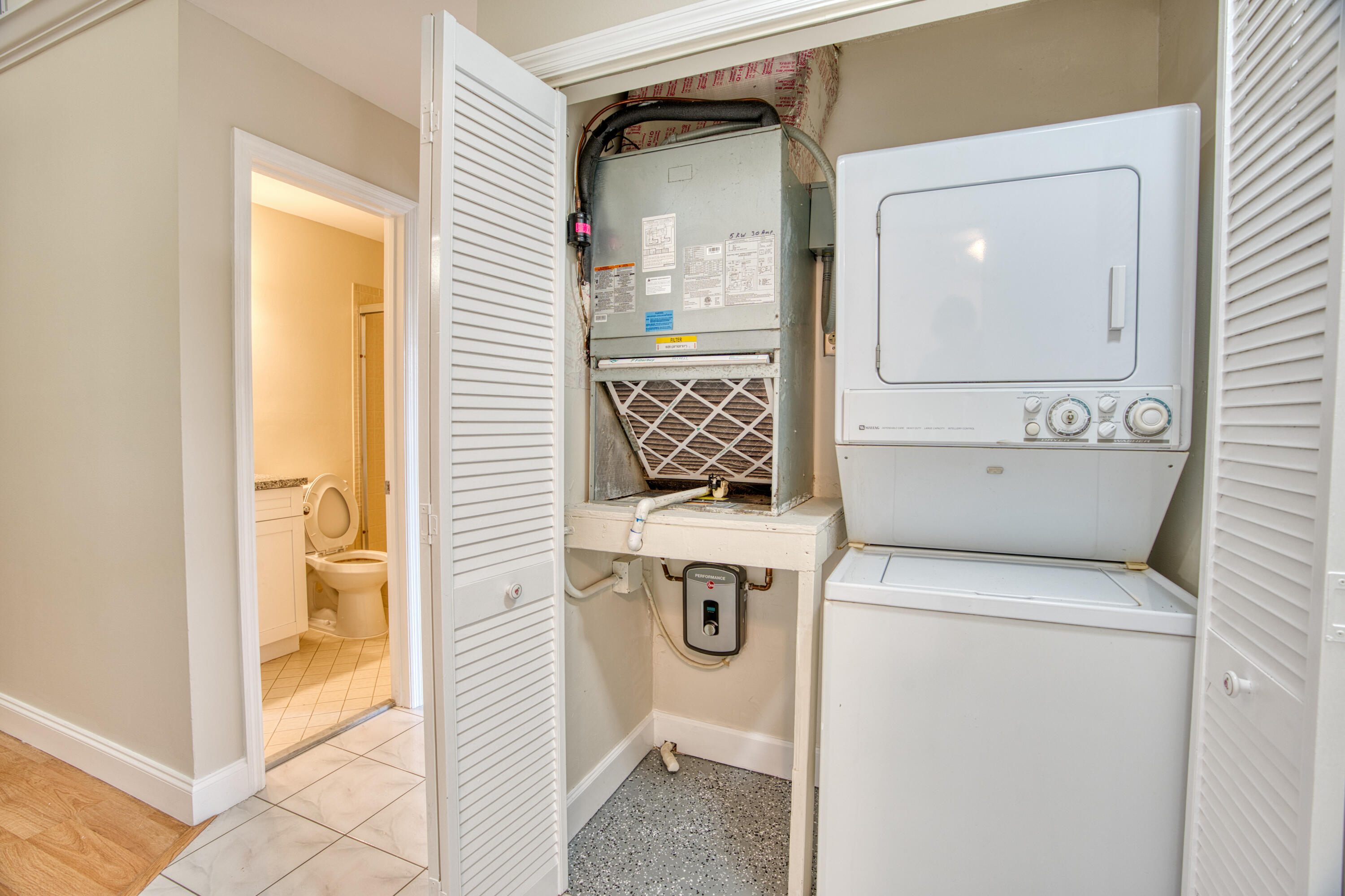 3151 Southeast Aster Lane, Unit 1306 Stuart, FL 34994 - Photo 25 of 27 a view of washer and dryer