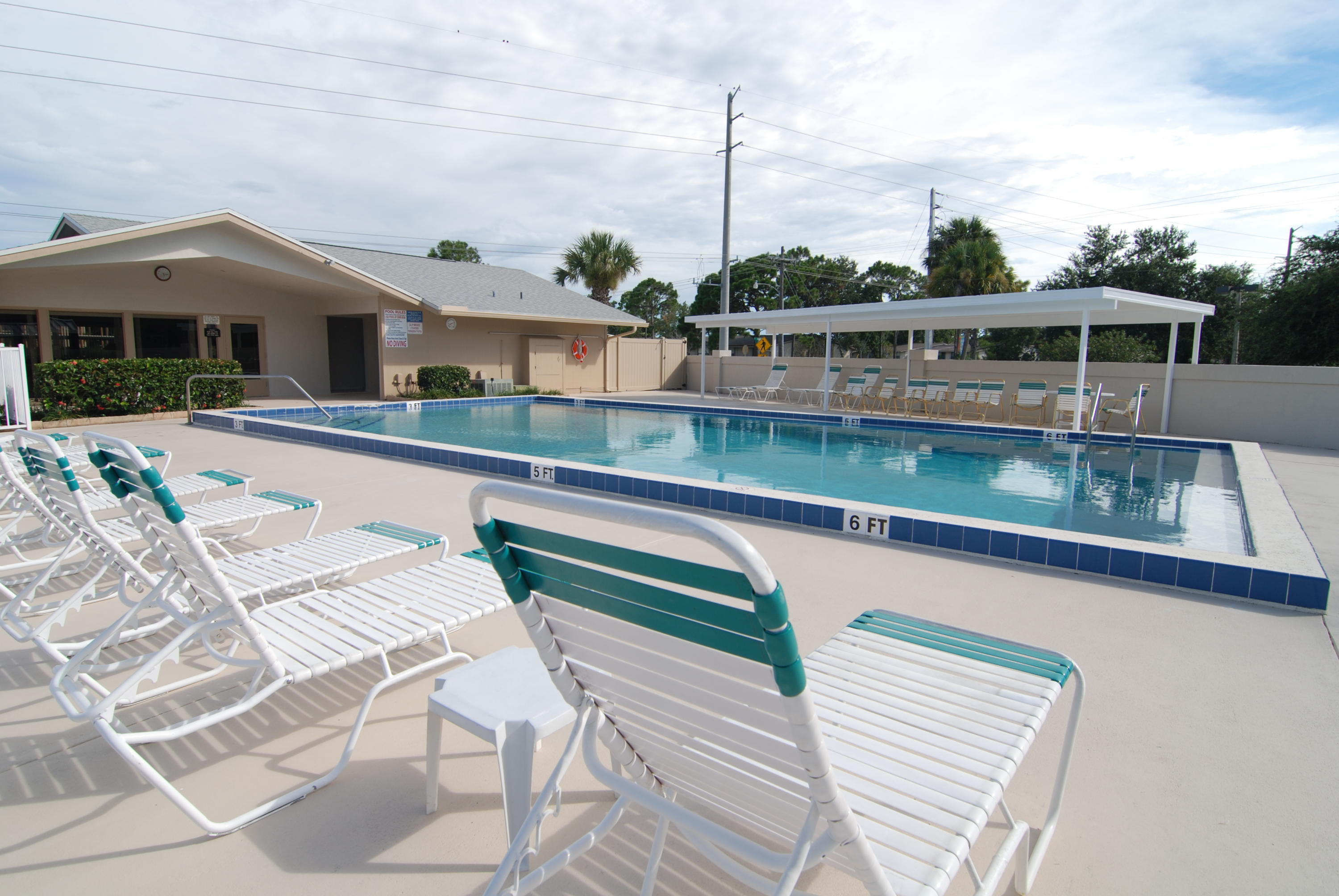 3151 Southeast Aster Lane, Unit 1306 Stuart, FL 34994 - Photo 4 of 27 a front view of house with yard
