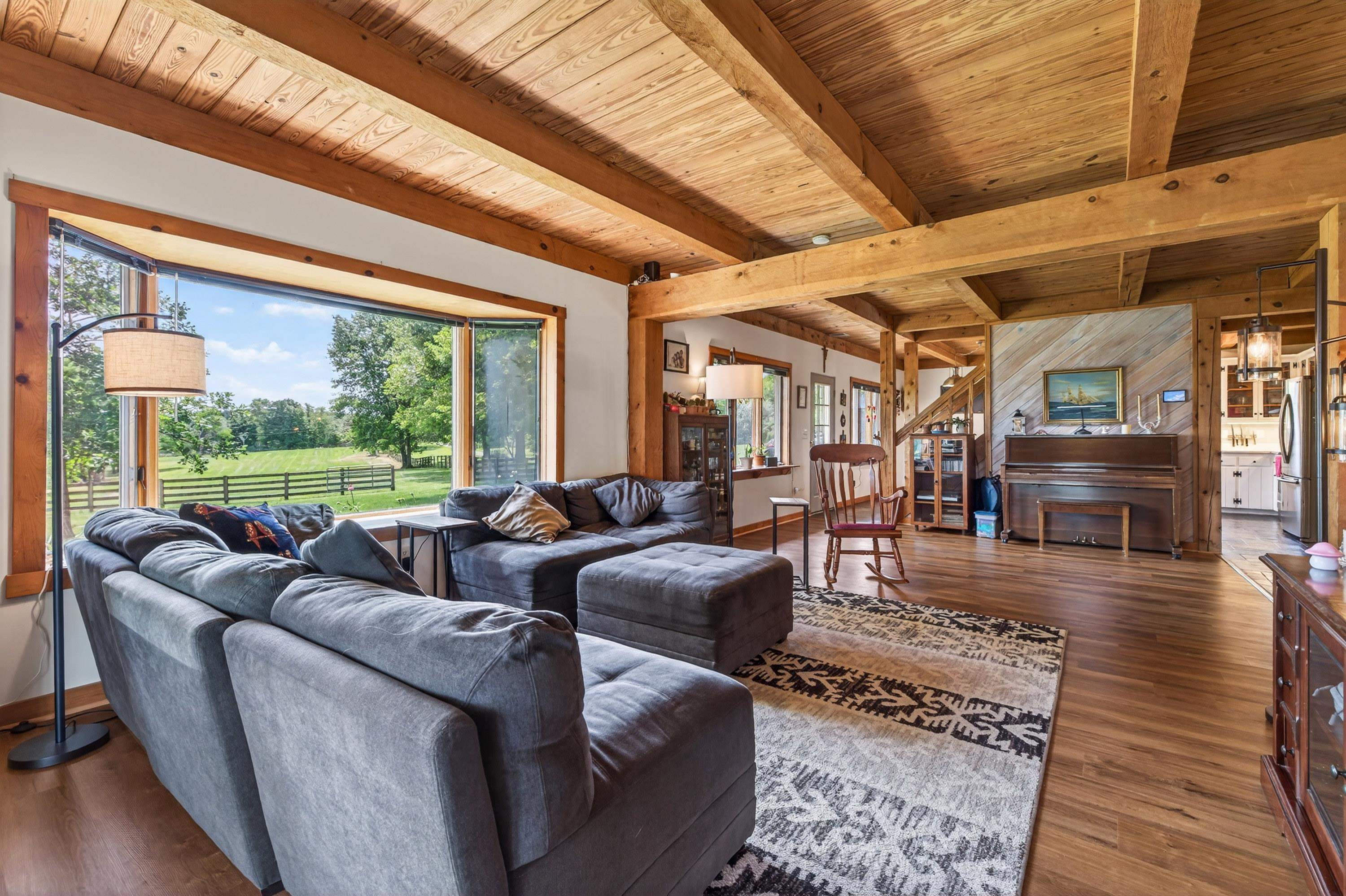 3980 Greenmount Road Harrisonburg, VA 22802 - Photo 11 of 75 The living room is expansive and features hardwood flooring, large windows, decorative ceilings, and plenty of space for gathering with family and friends.