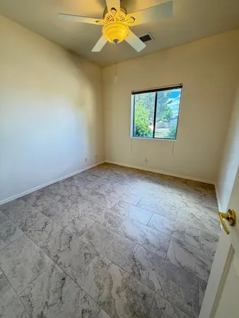 a view of a storage & utility room with a fireplace