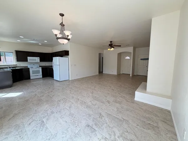 a view of a livingroom with a kitchen