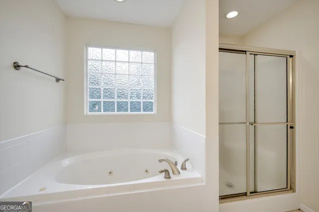a white bath tub with a window
