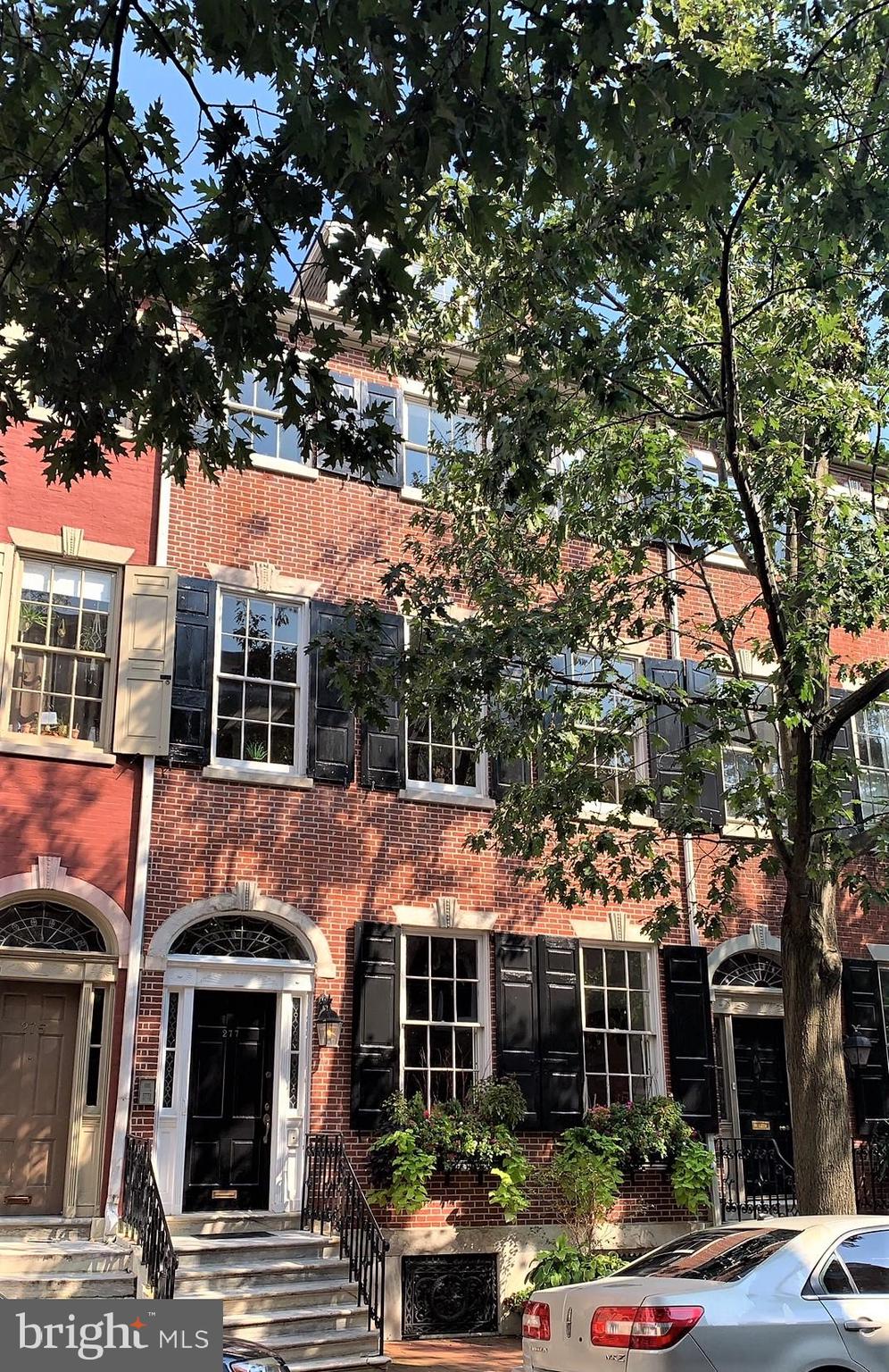 277 South 4th Street, Unit 1F Philadelphia, PA 19106 - Photo 1 of 12 a view of house with a tree in front of it