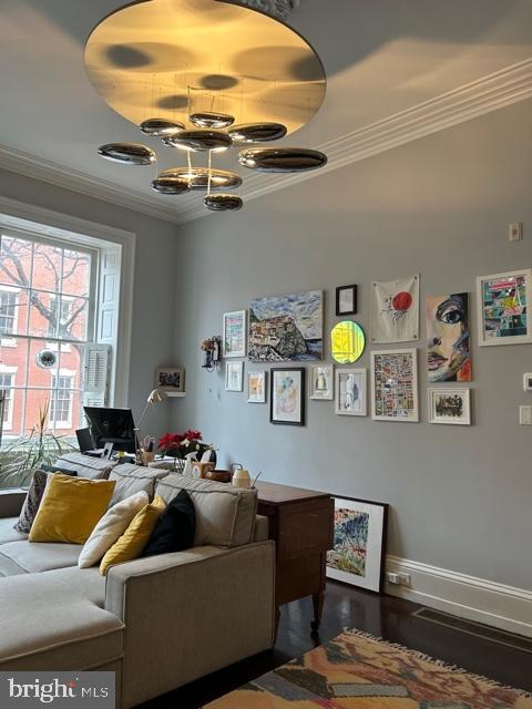 277 South 4th Street, Unit 1F Philadelphia, PA 19106 - Photo 3 of 12 a living room with furniture and a chandelier