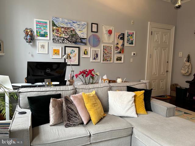 277 South 4th Street, Unit 1F Philadelphia, PA 19106 - Photo 4 of 12 a living room with furniture and a couch