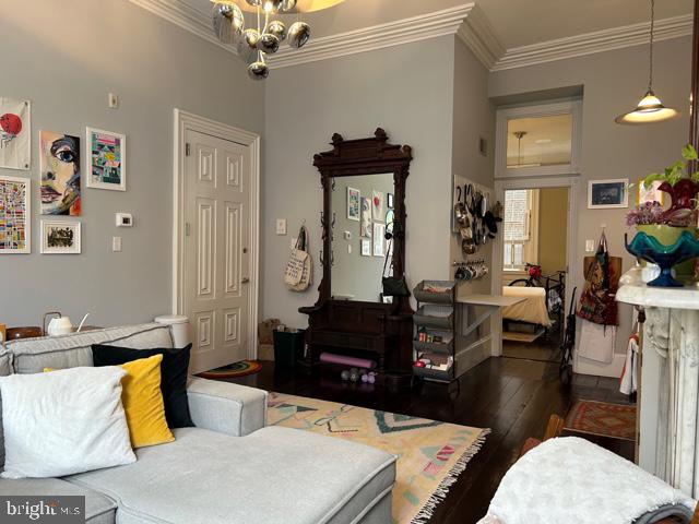 277 South 4th Street, Unit 1F Philadelphia, PA 19106 - Photo 6 of 12 a living room with furniture and a chandelier