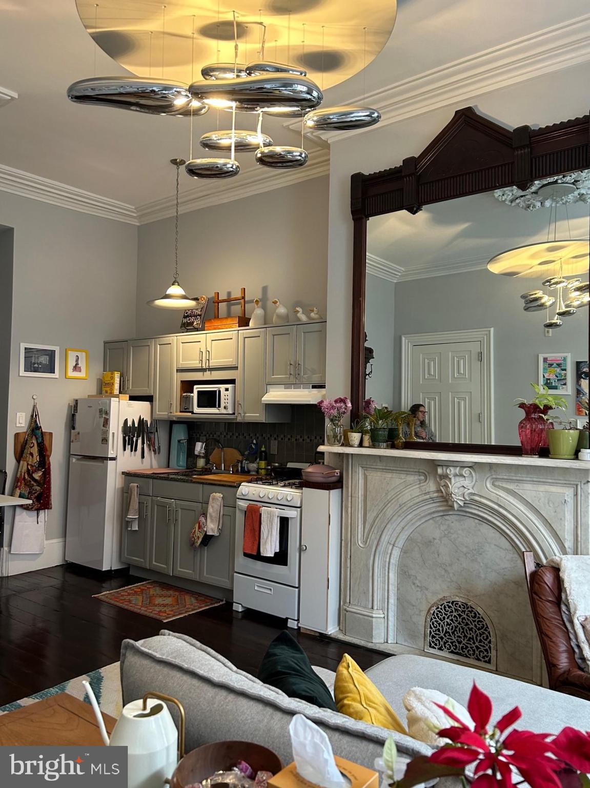 277 South 4th Street, Unit 1F Philadelphia, PA 19106 - Photo 7 of 12 a kitchen with a sink dishwasher and a stove with wooden floor