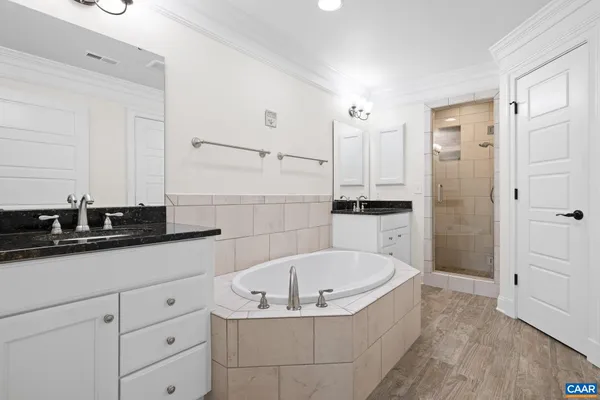 a bathroom with a bathtub and a sink
