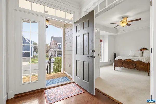 a bedroom with furniture and a chandelier