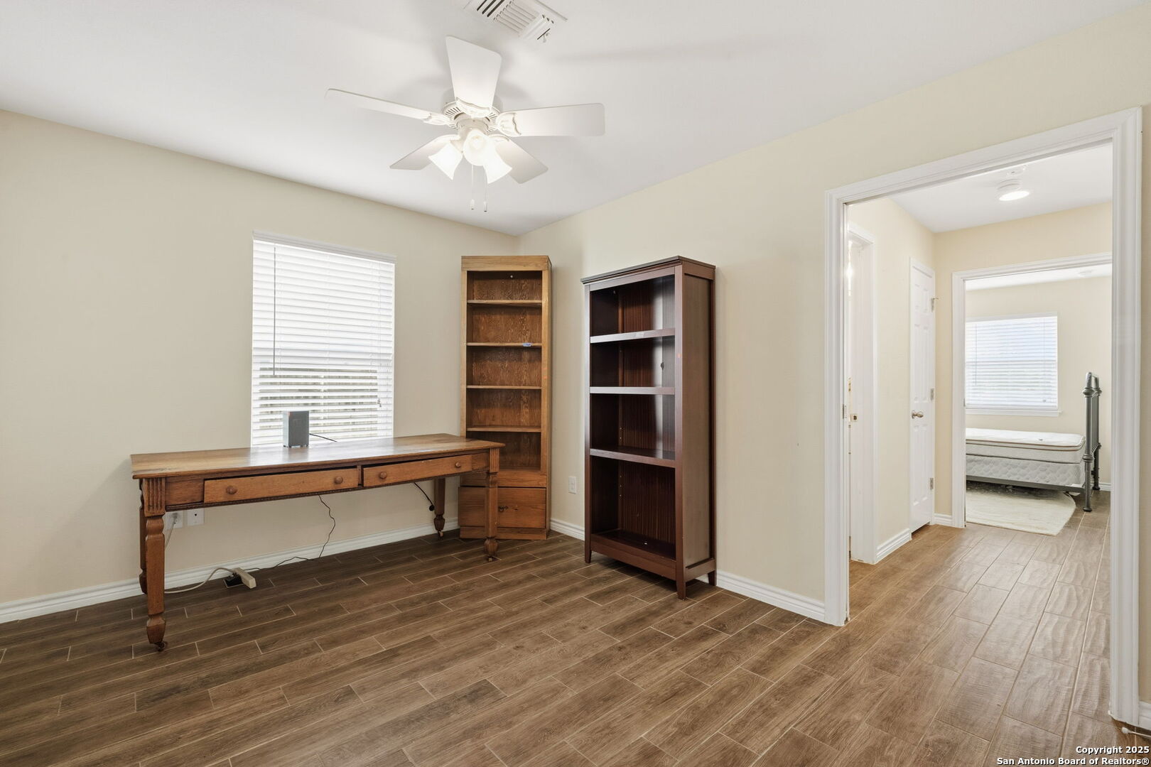 533 Indian Jourdanton, TX 78026 - Photo 13 of 27 wooden floor with a window in a room