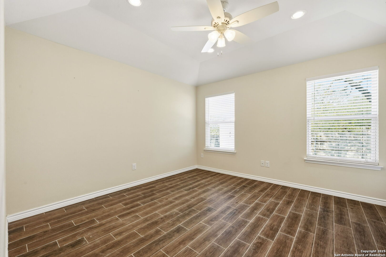 533 Indian Jourdanton, TX 78026 - Photo 15 of 27 wooden floor in an empty room with a window
