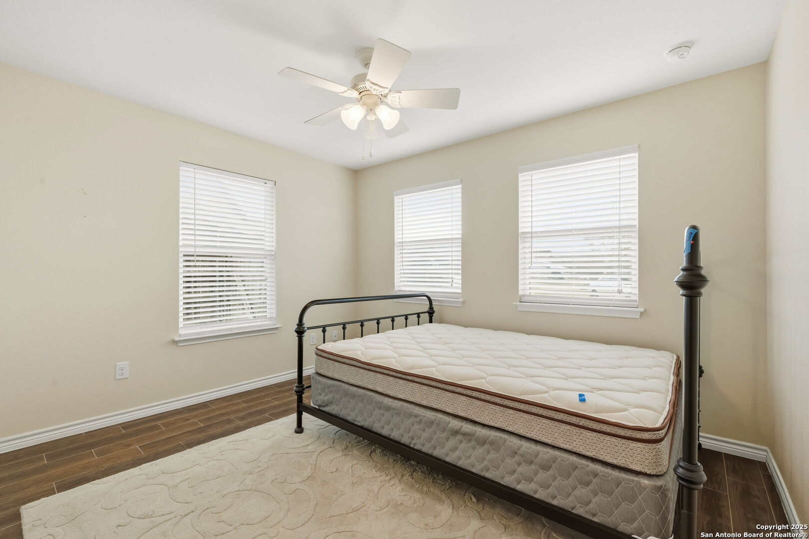 533 Indian Jourdanton, TX 78026 - Photo 19 of 27 a bed sitting in a bedroom next to a window