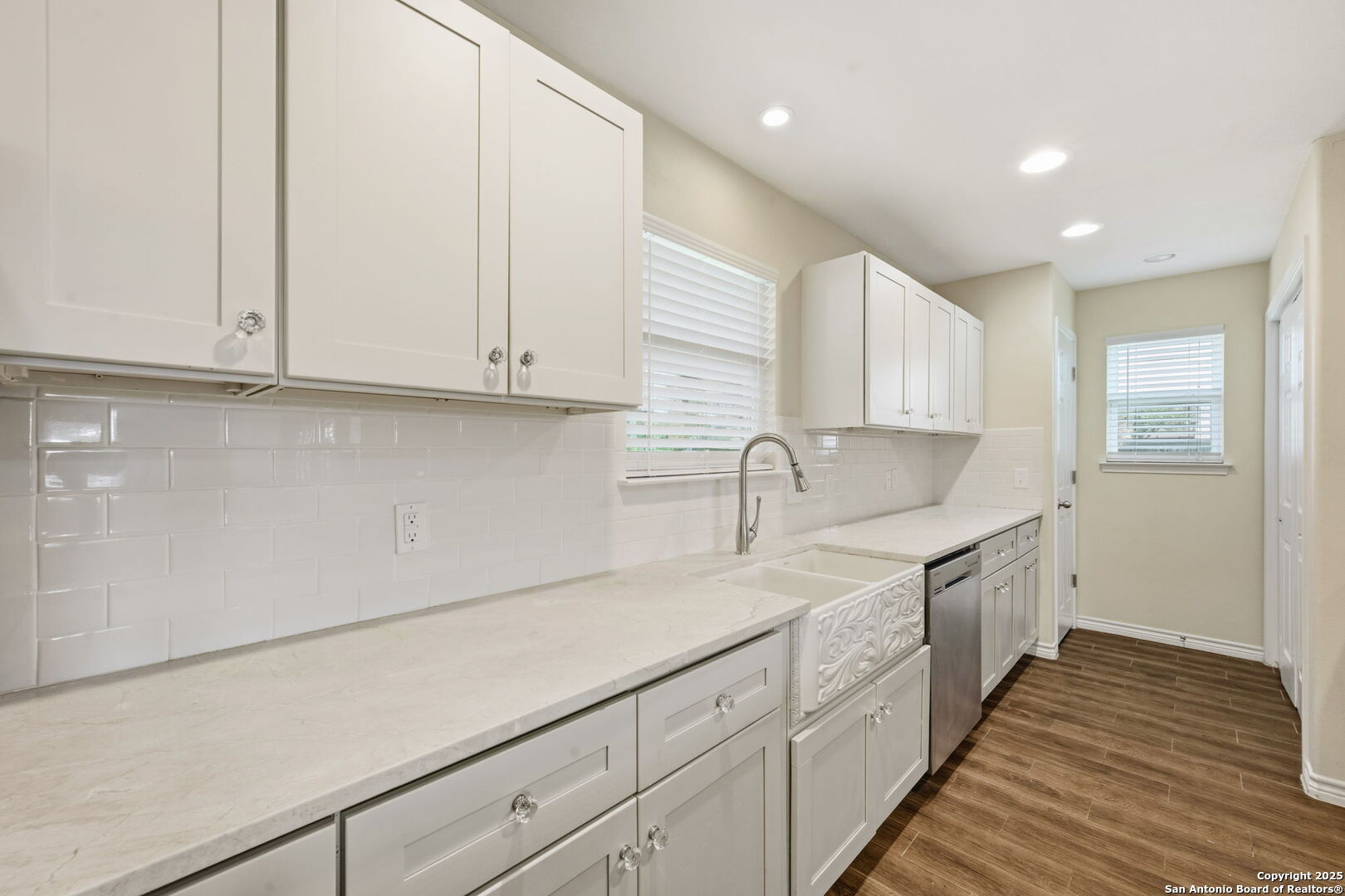533 Indian Jourdanton, TX 78026 - Photo 9 of 27 a kitchen with a sink and cabinets