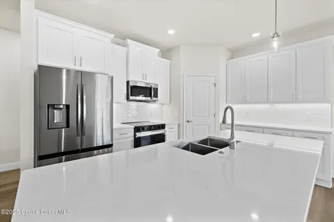 a kitchen with a stove and a microwave