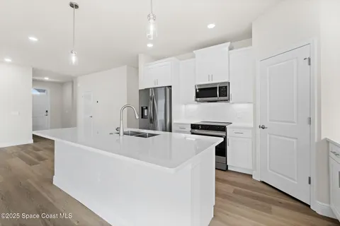 a white bath tub sitting next to a white toilet