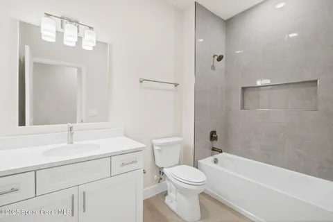 a bathroom with a shower and a toilet