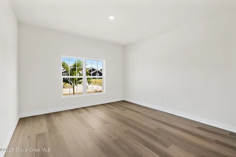 a view of an empty room with a yard