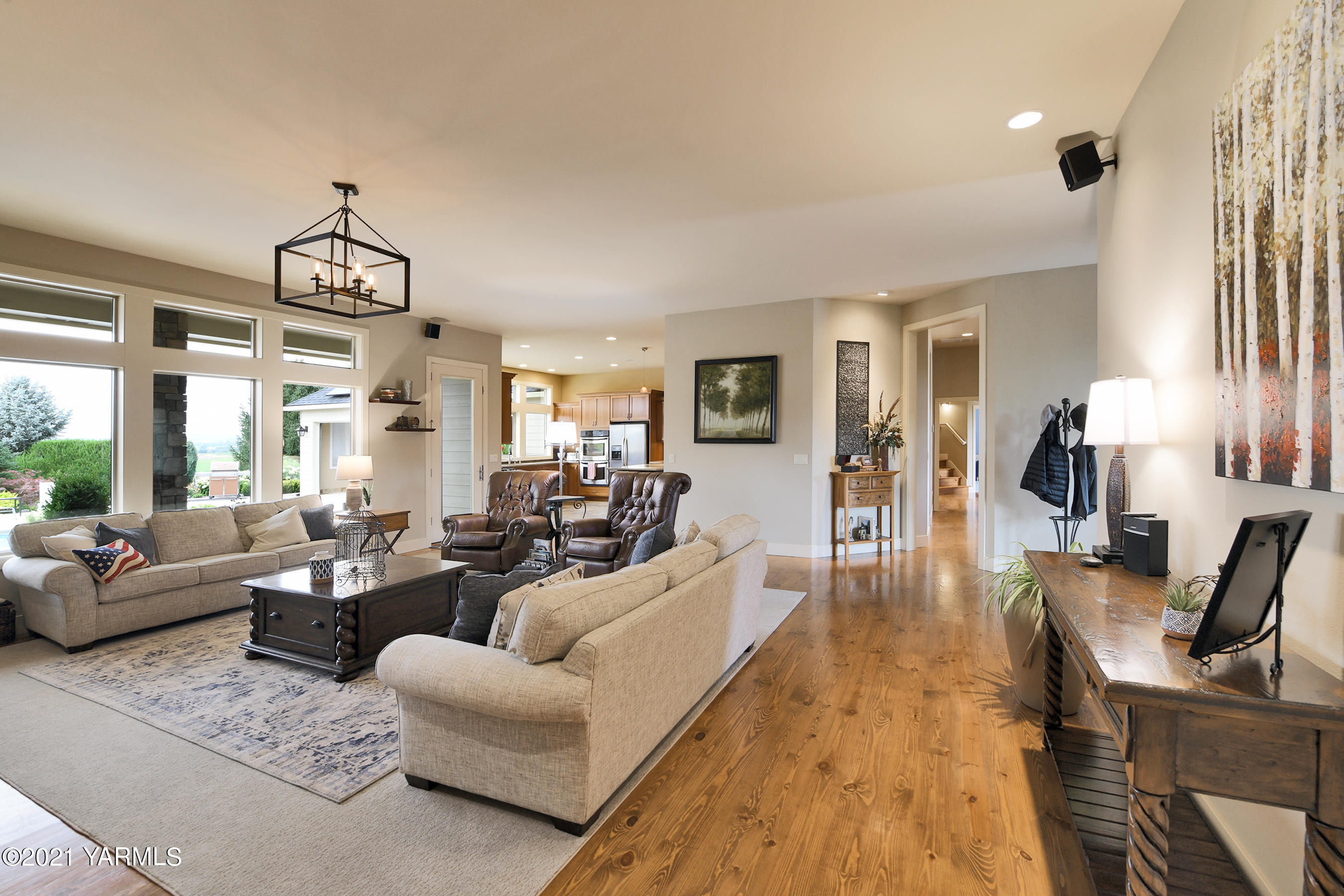 478 Pomona Heights Road Yakima, WA 98901 - Photo 16 of 60 a living room with furniture dining table and a chandelier