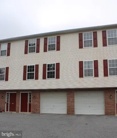 a front view of building with a lot of windows