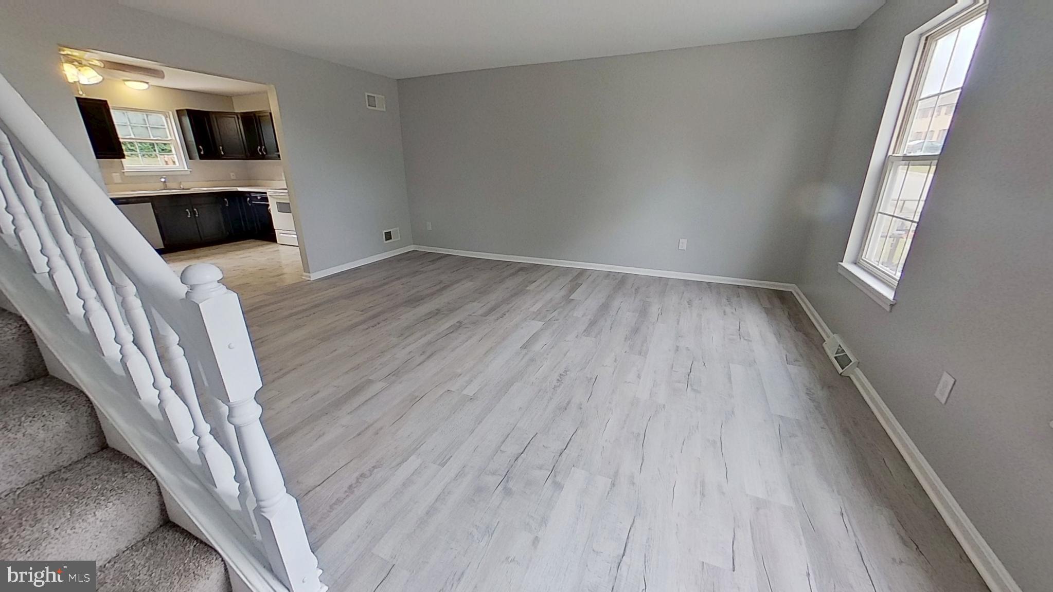 231 Olney Road Dallastown, PA 17313 - Photo 2 of 8 a view of a livingroom with wooden floor and electronic appliances